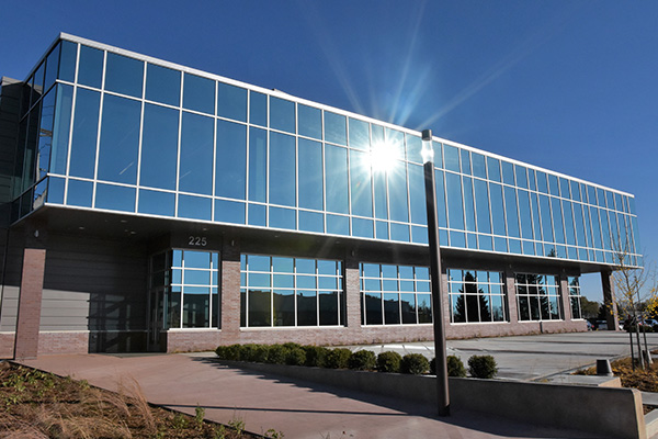 Exterior of the Boman Fine Arts Center, a building with lots of windows